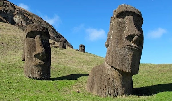 The moai heads at Rano Raraku, the quarry on Easter Island. The sculptures have bodies attached, but they are buried under the dirt and not visible. About 400 moai are here in various stages of carving. (Karen Schwartz/AP)