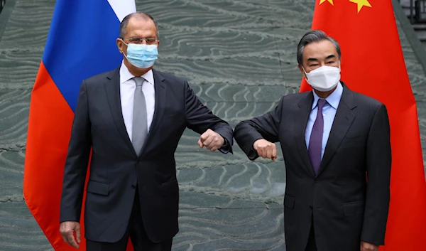 Russian Foreign Minister Sergei Lavrov and Chinese Foreign Minister Wang Yi in Guilin, China March 22, 2021 (Reuters)