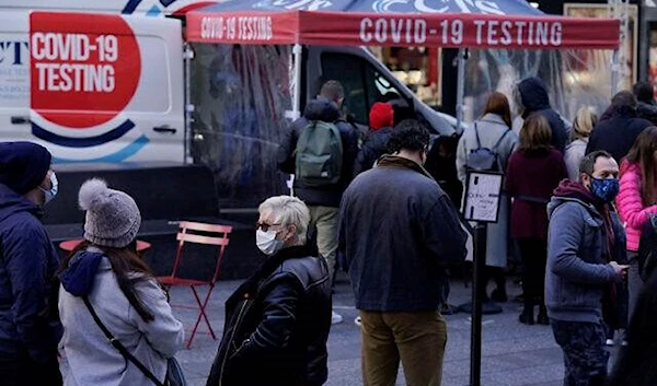 People wait in line at a COVID-19 testing site in New York, Dec. 13, 2021 (AP)