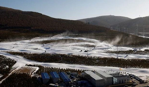 Snow guns operating on slopes during a media tour to Beijing 2022 Winter Olympics venues in Zhangjiakou (Reuters)