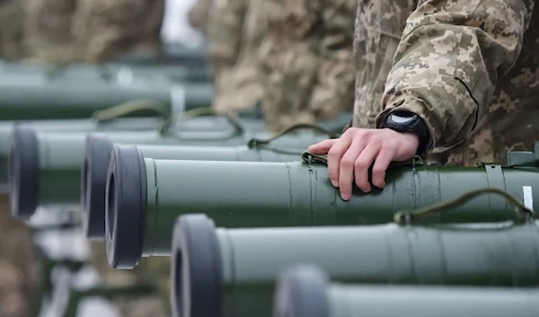 Ukrainian soldiers attend the handover ceremony of US military heavy weapons and equipment in Kiev, 2018. (AFP)