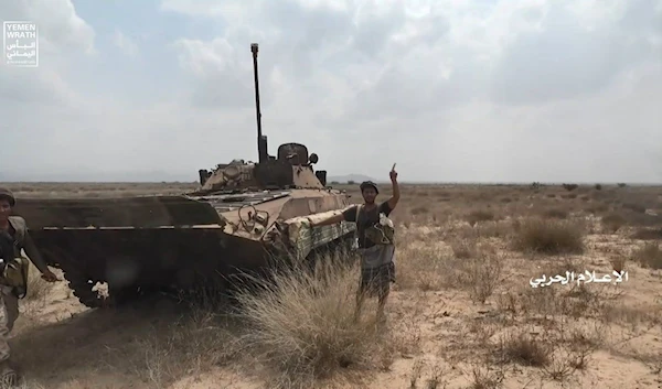 Yemeni armed forces and popular committees soldiers standing next to a captured Saudi backed forces BMP-2 (Yemeni Military Media)