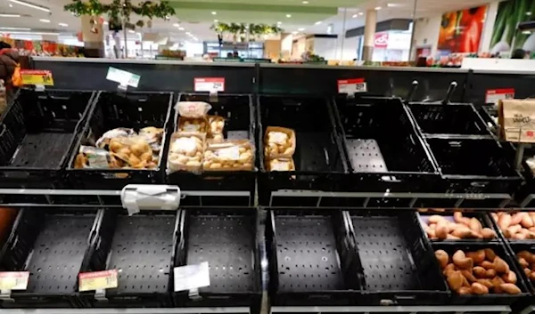 Partially emptied shelves at a Rewe grocery store in Germany (Reuters)