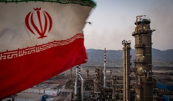 An Iranian national flag flies over a refinery in Bandar Abbas, Iran. (Bloomberg)