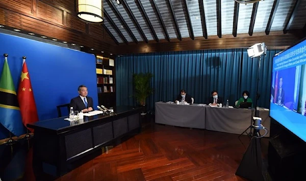 Chinese State Councilor and Foreign Minister Wang Yi holds talks with Tanzanian Foreign Minister Liberata Mulamula via video link in Tunxi, east China's Anhui Province, March 20, 2022. (Xinhua)