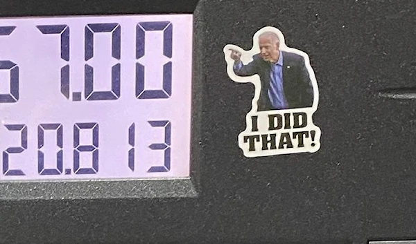 Stickers featuring President Joe Biden pointing at the gas total and saying “I did that!” (Kerry Picket/The Washington Times).