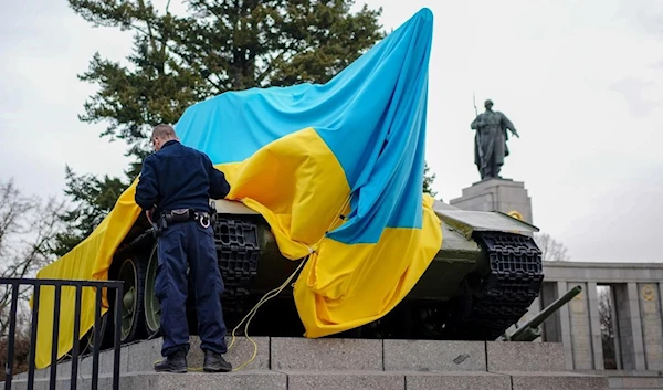 Ukrainian flags draped on a Soviet T-34 tank in central Berlin