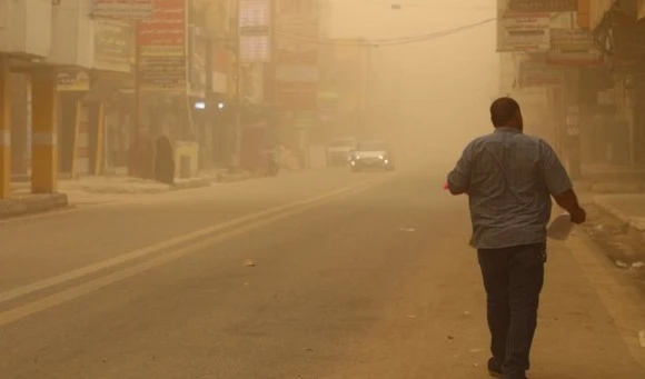 A man walks in a street during a dust storm in Iraq’s city of Nasiriyah in the southern Dhi Qar province, on Saturday. (AFP)