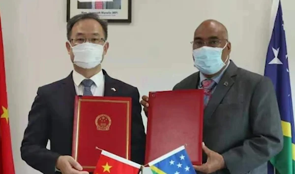 China's ambassador to Solomon Islands and Solomon Islands diplomat Colin Beck after signing the treaty (Chinese Embassy)