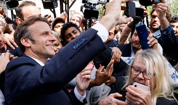 French President Emmanuel Macron in Seine-Saint-Denis, France, on April 21, 2022 (AFP)