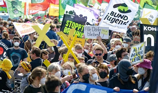 Thousands protest plans to destroy German village for coal mine