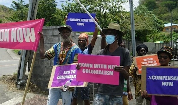 Protesters held banners saying "down with neo-colonialism".