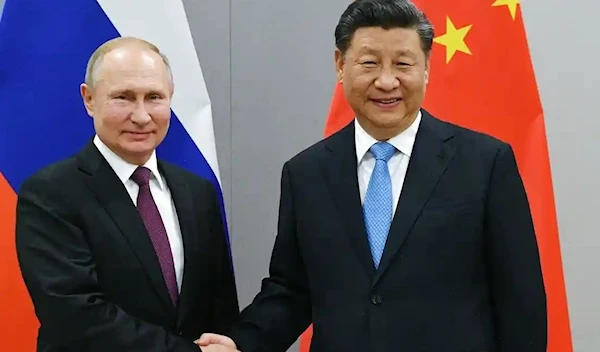 Vladimir Putin and Xi Jinping (AP)