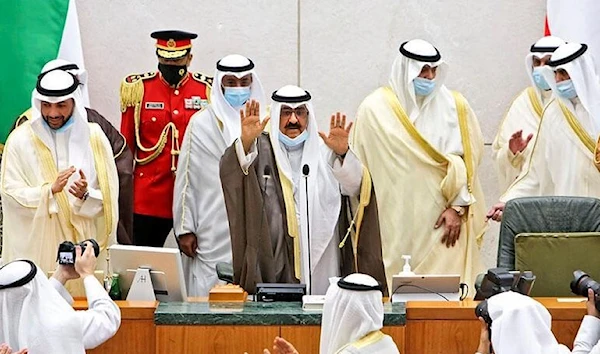 The new Kuwaiti Crown Prince, Sheikh Meshal al-Ahmad al-Jaber Al-Sabah (C), makes a gesture when he is sworn in before Parliament on 8 October 2020 in Kuwait City.