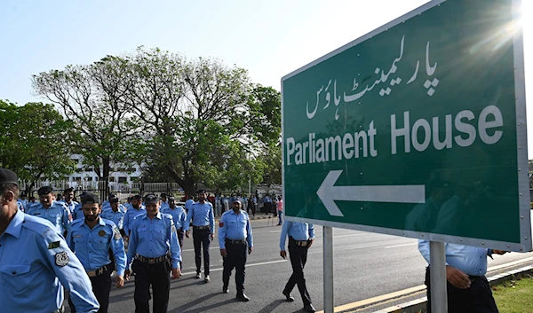 Sign in Islamabad pointing to the direction of the Pakistani National Assembly