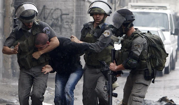 Israeli occupation forces assaulting a Palestinian. (Archive)