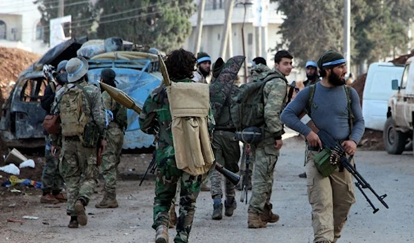 Armed men in the town of Afrin.