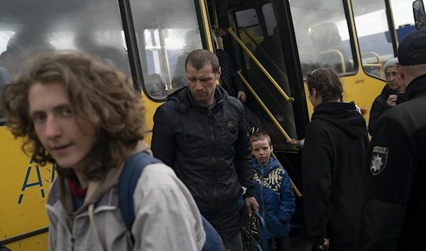 Refugees from Mariupol arrive at a refugee center  in Zaporizhzhia, Ukraine, April 21, 2022