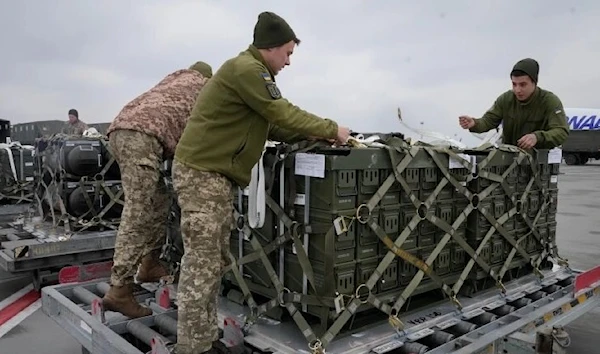 Ukrainian servicemen unpack an earlier shipment of US military aid at Boryspil airport outside Kyiv, Ukraine, February 11, 2022. (AP)