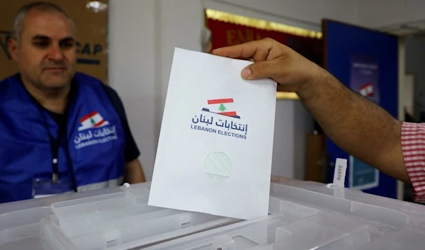 A Lebanese citizen casting his ballot in the 2022 legislative elections