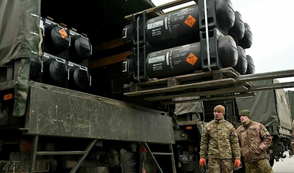 Ukrainian servicemen load a truck with the FGM-148 Javelin provided by the United States to Kiev (AFP)