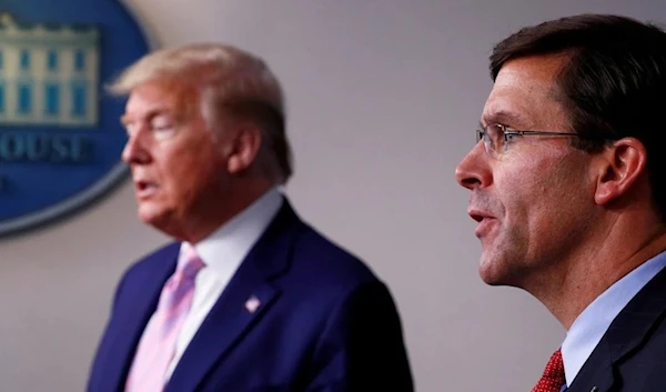 Former US Defense Secretary Mark Esper standing next to former US President Donald Trump