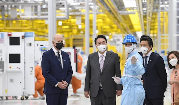 U.S. President Joe Biden and South Korean President Yoon Suk-yeol visit a Samsung Electronics plant on Friday in Pyeongtaek, South Korea. | POOL / VIA REUTERS