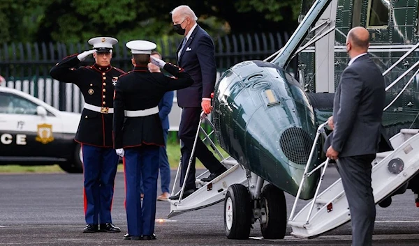 US President Joe Biden disembarks from the Marine One helicopter at a landing zone in Tokyo, Japan May 22, 2022 (Reuters)