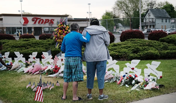 At a memorial outside the Tops supermarket in Buffalo where a gunman killed 10 people on May 14 (Getty)