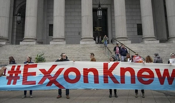 Environmental activists rally outside of New York Supreme Court in October in Manhattan.