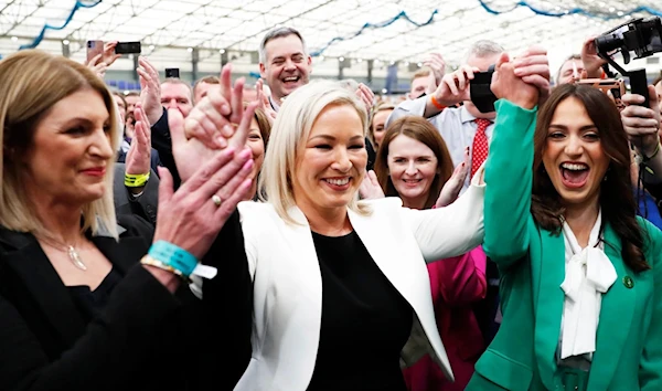 Sinn Fein's Vice President Michelle O'Neill, centre, celebrates with party colleagues after being elected in Mid Ulster at the Medow Bank election count centre in Magherafelt , Northern Ireland, Friday, May, 6, 2022. (AP)