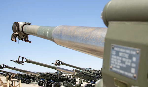 US Marine Corps M777 towed 155 mm howitzers staged on the flight line ahead of being loaded onto a US Air Force C-17 Globemaster III aircraft bound for Europe for delivery to Kiev, at March Air Reserve Base, California, US April 22, 2022 (Reuters)