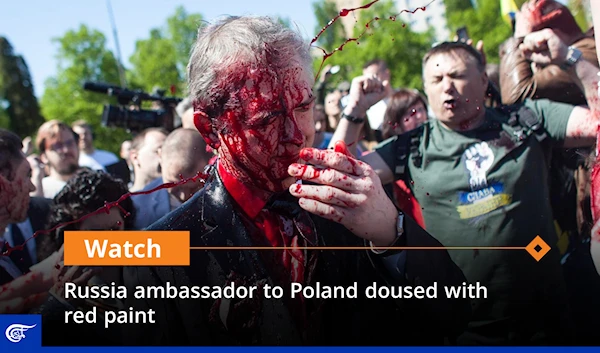 Russia ambassador to Poland doused with red paint