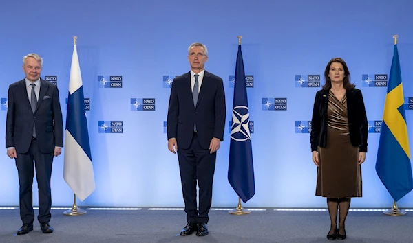 NATO Secretary-General Jens Stoltenberg, Finnish Foreign Minister Pekka Haavisto, and Swedish Foreign Minister Ann Linde at the NATO headquarters in Brussels on January 24 (AFP)