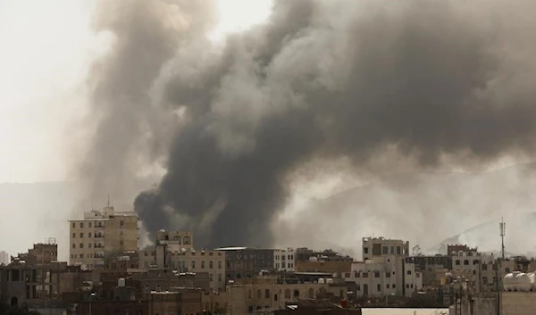 Smoke rises from the site of Saudi-led air strikes in Sanaa, Yemen, March 7, 2021 (Reuters)