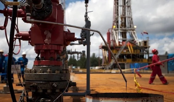 Crude oil drips from a valve at an oil well operated by Venezuela's state oil company PDVSA in Morichal July 28, 2011. (Reuters)