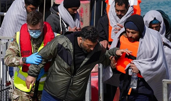 A group of people thought to be migrants are brought to Dover, Kent, following a small boat incident in the English Channel