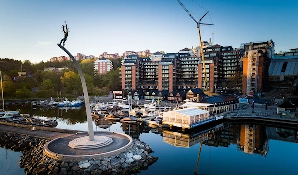 A drone picture shows a development of former office buildings into apartments in Stockholm (Reuters)