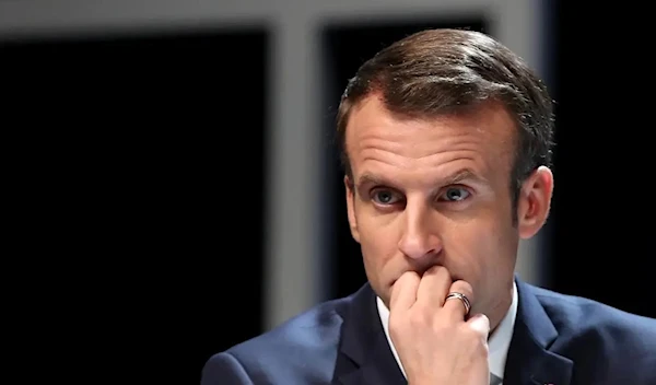 Projections by French firms show that Macron will be short on the 289 seats he needs for a majority (Reuters)