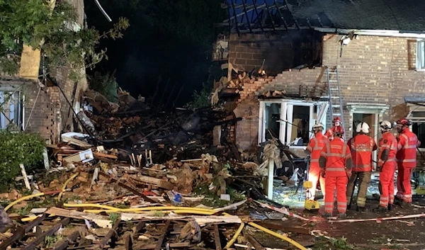 A firefighters crew at the destroyed house in Kingstanding, Birmingham, the United Kingdom, on June 27, 2022