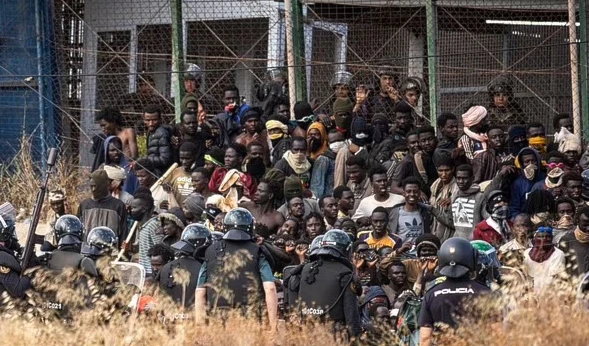 Refugees on the border between Melilla and Morocco. (AP)