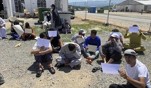 Afghans who fled the Taliban from Afghanistan staging a protest at Camp Bondsteel in Kosovo, Wednesday, June 1, 2022