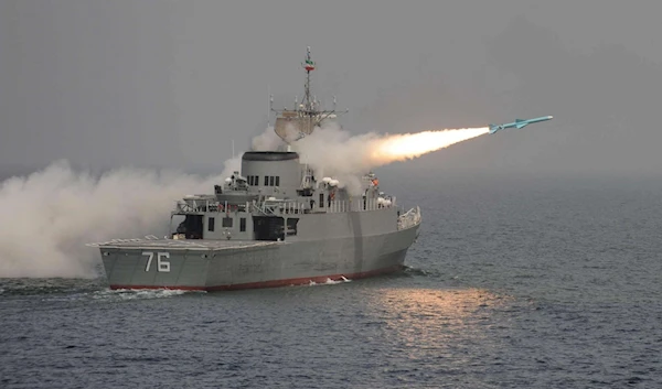 An Iranian warship testing ballistic and cruise missiles in the Gulf