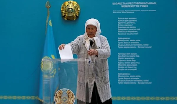 A voter casts her ballot during a constitutional referendum at a polling station in Kazakhstan (REUTERS)