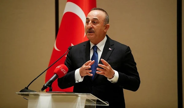 Turkish Foreign Minister Mevlut Cavusoglu speaks during a joint news conference with Bahrain's Foreign Minister Abdullatif Al-Zayani, in Manama, Bahrain, January 31, 2022 (Reuters)