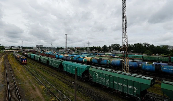 A view shows a freight train and cars, following Lithuania's ban of the transit of goods through the Russian exclave of Kaliningrad (Reuters)