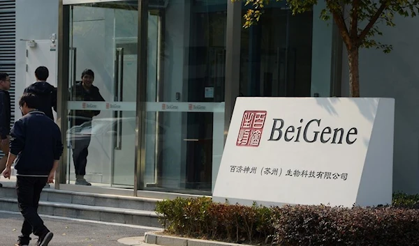 People enter a building of biotechnology firm BeiGene Ltd at the Suzhou Industrial Park in Suzhou, Jiangsu province, China November 22, 2019. Picture taken November 22, 2019. REUTERS/Stringer