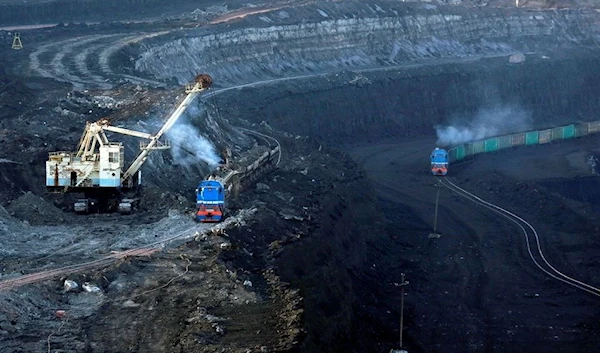 A train transports coal at Borodinsky opencast colliery, owned by the Siberian Coal Energy Company (SUEK), near the Siberian town of Borodino east of Krasnoyarsk, Russia February 26, 2019. REUTERS/Ilya Naymushin