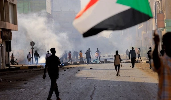 The Sudanese police disperse protesters in the capital Khartoum using tear gas (Reuters).