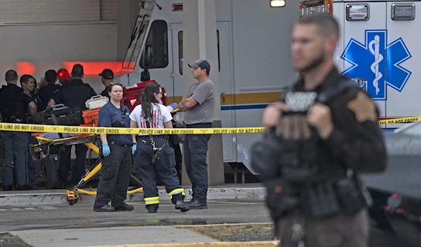 Emergency personnel gather after a deadly shooting Sunday, July 17, 2022, at the Greenwood Park Mall, in Greenwood, Indiana, United States (AP)